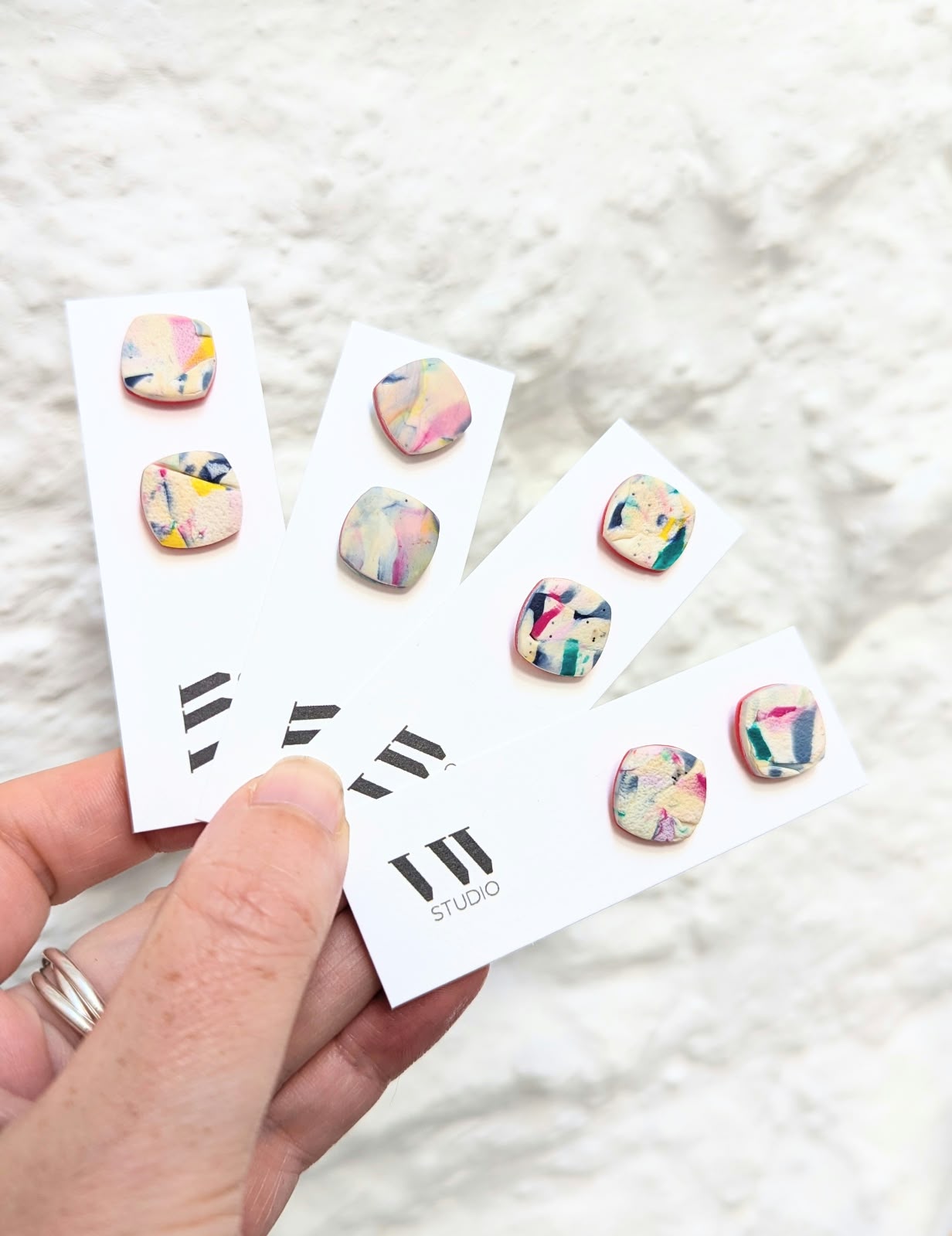 Four pairs of pastel patterned VW Studio stud earrings